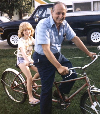 Rose Painter with Harold Kissell on a bicycle built for two.